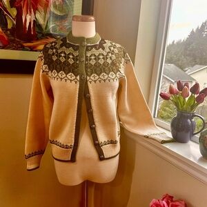 A Classic Hand Knit Norwegian Cardigan in a traditional feminine pattern